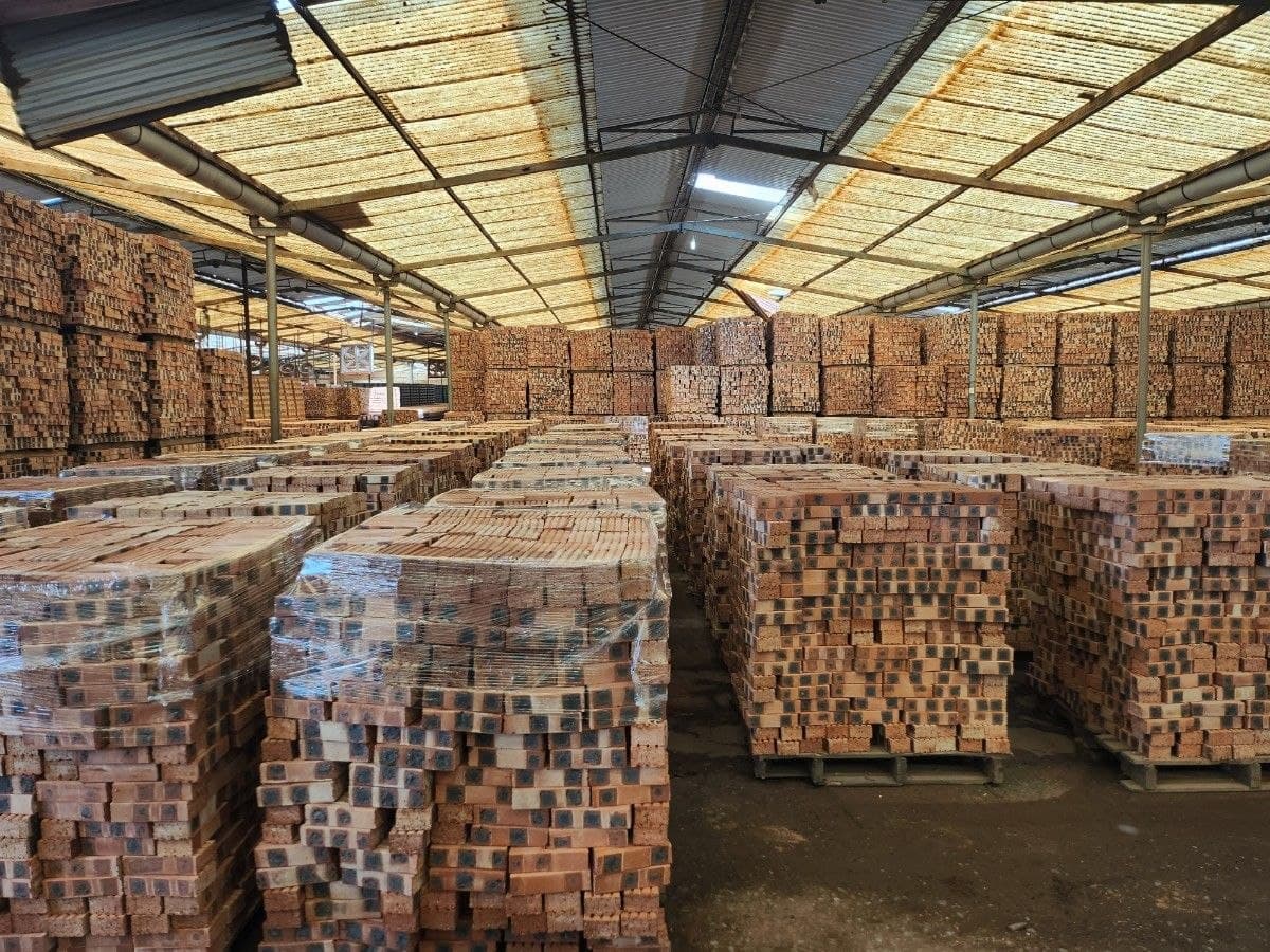 Large quantities of finished bricks arranged for storage and distribution.